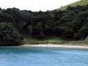 Lone campers on island beach in Bay of Islands